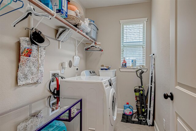3619 Canton Hills Ln, Missouri City, TX 77459 - clothes washing area featuring washer and dryer, tile patterned flooring, and baseboards