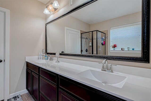 3619 Canton Hills Ln, Missouri City, TX 77459 - bathroom with a stall shower, double vanity, and tile patterned flooring