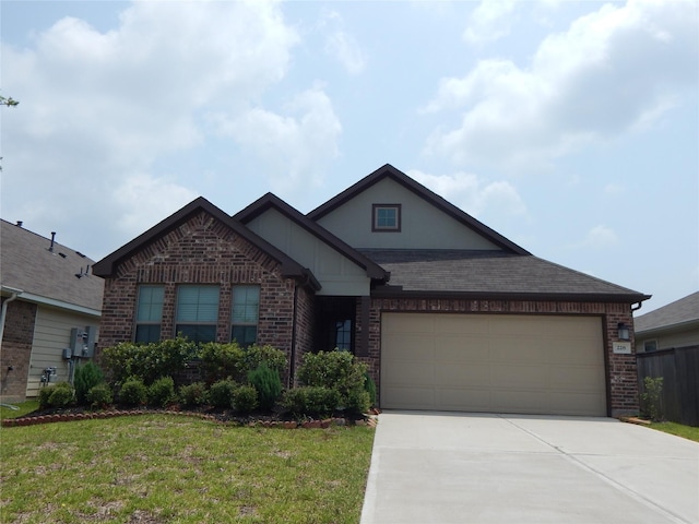 228 Rustic Ridge Cir, Magnolia, TX 77354 - view of front facade featuring brick siding, driveway, an attached garage, a front yard, and roof with shingles