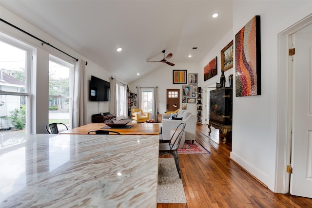 1127 Nadine St, Houston, TX 77009 - dining room featuring healthy amount of natural light, wood finished floors, ceiling fan, a fireplace, and lofted ceiling