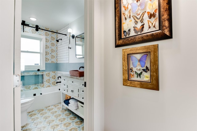 1127 Nadine St, Houston, TX 77009 - full bath with toilet, vanity, tile patterned flooring, and shower / bath combination