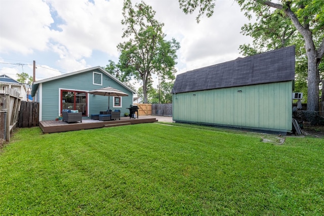 1127 Nadine St, Houston, TX 77009 - rear view of house featuring outdoor lounge area, a deck, an outbuilding, a storage shed, and a shingled roof