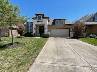 4723 Abercorn St, Rosharon, TX 77583 - french country style house with driveway, a garage, and a front yard
