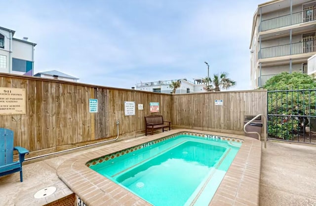 6300 Seawall Blvd Unit 3113, Galveston, TX 77551 - view of swimming pool with fence