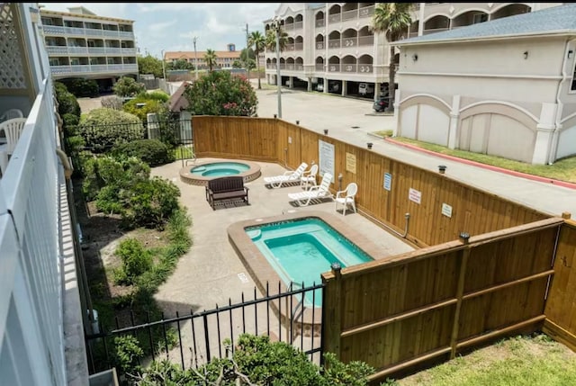 6300 Seawall Blvd Unit 3113, Galveston, TX 77551 - community pool with a community hot tub and a patio