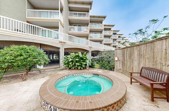 6300 Seawall Blvd Unit 3113, Galveston, TX 77551 - view of pool with fence and a community hot tub