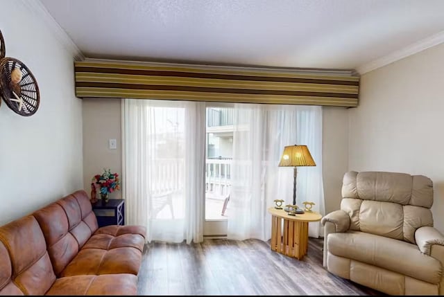6300 Seawall Blvd Unit 3113, Galveston, TX 77551 - living area with ornamental molding and wood finished floors