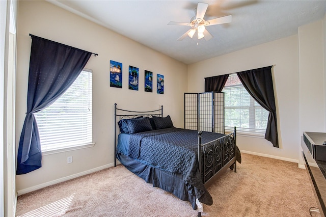 2127 Linden Rock Dr, Katy, TX 77494 - carpeted bedroom with baseboards and a ceiling fan