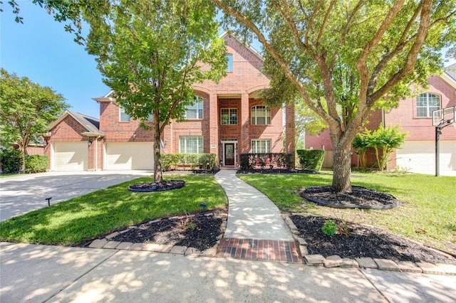 2127 Linden Rock Dr, Katy, TX 77494 - view of front of home featuring brick siding, driveway, a front yard, and a garage