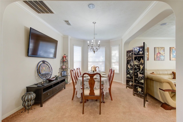 2127 Linden Rock Dr, Katy, TX 77494 - dining room with light carpet, a chandelier, crown molding, and baseboards