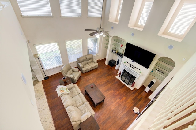 2127 Linden Rock Dr, Katy, TX 77494 - living area featuring a towering ceiling, a ceiling fan, and tile patterned floors