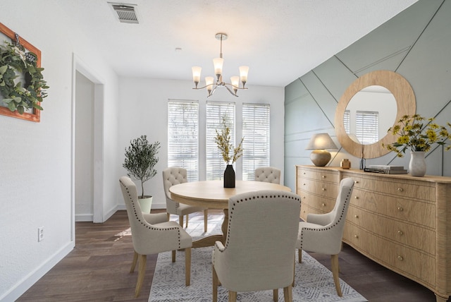 102 Banyan St, Lake Jackson, TX 77566 - dining space featuring a chandelier and dark wood-style floors
