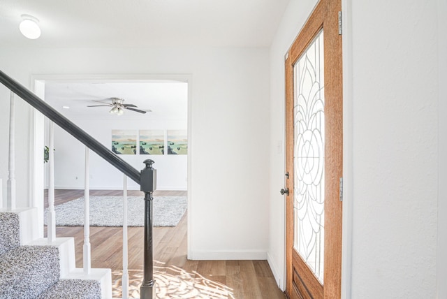102 Banyan St, Lake Jackson, TX 77566 - entryway featuring stairway, wood finished floors, and a ceiling fan