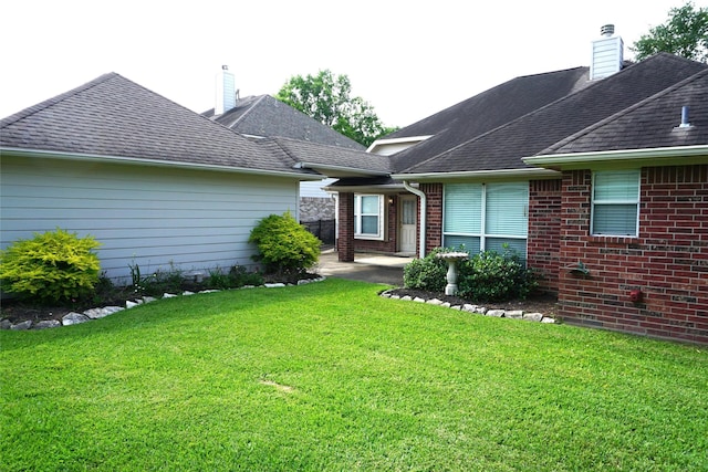 11714 Goldstream Ct, Tomball, TX 77377 - rear view of property with a chimney, a yard, a patio, and brick siding