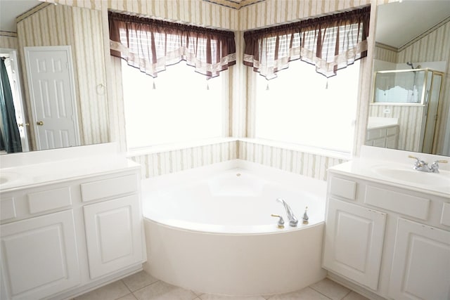 11714 Goldstream Ct, Tomball, TX 77377 - full bath with wallpapered walls, a shower stall, a garden tub, tile patterned flooring, and two vanities
