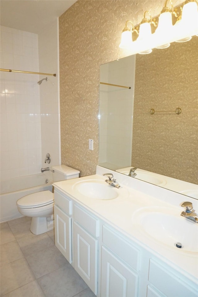 11714 Goldstream Ct, Tomball, TX 77377 - bathroom featuring wallpapered walls, toilet, double vanity, tile patterned floors, and tub / shower combination