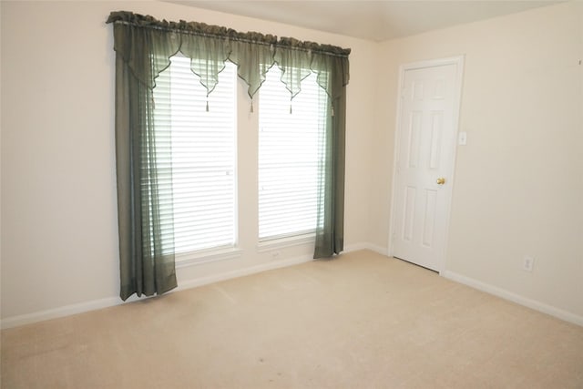 11714 Goldstream Ct, Tomball, TX 77377 - empty room with light carpet, baseboards, and plenty of natural light