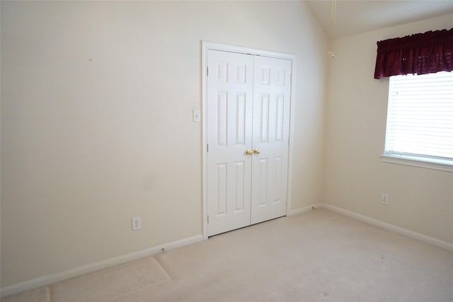 11714 Goldstream Ct, Tomball, TX 77377 - unfurnished bedroom with a closet, carpet, baseboards, and vaulted ceiling