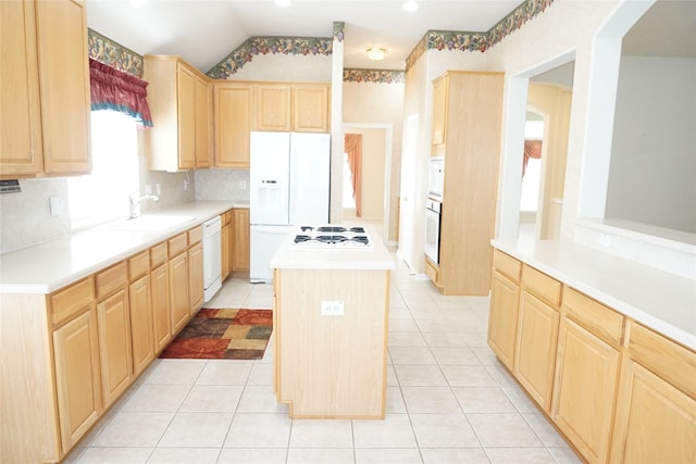 11714 Goldstream Ct, Tomball, TX 77377 - kitchen featuring light brown cabinets, white appliances, a kitchen island, tasteful backsplash, and lofted ceiling