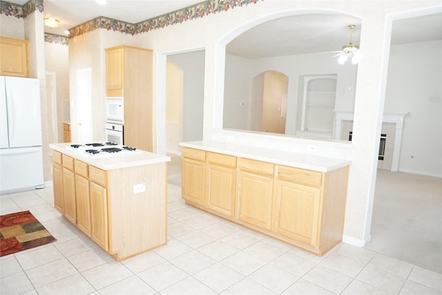11714 Goldstream Ct, Tomball, TX 77377 - kitchen featuring light brown cabinets, white appliances, a ceiling fan, light tile patterned flooring, and light countertops
