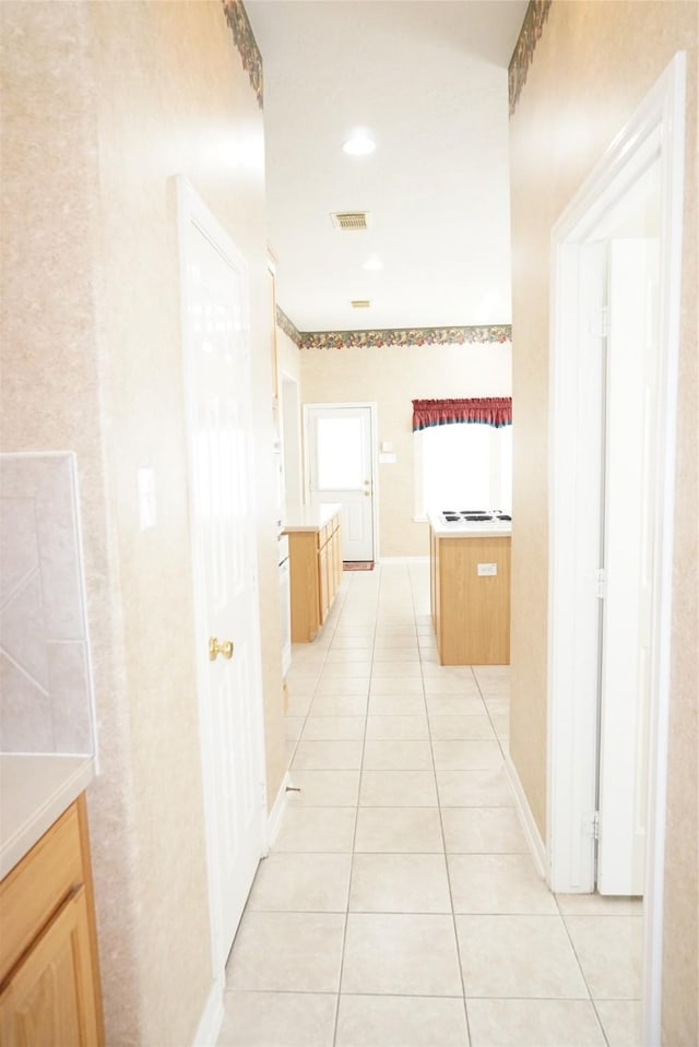 11714 Goldstream Ct, Tomball, TX 77377 - hallway featuring light tile patterned floors
