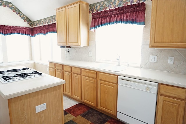 11714 Goldstream Ct, Tomball, TX 77377 - kitchen featuring white appliances, a sink, vaulted ceiling, tasteful backsplash, and light brown cabinets