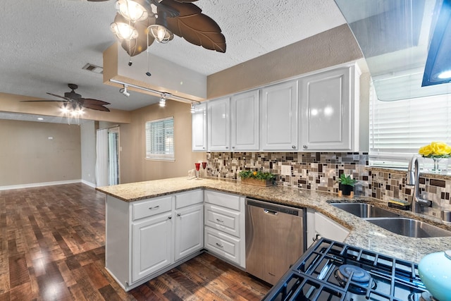 4302 Marchant Rd, Houston, TX 77047 - kitchen featuring ceiling fan, dishwasher, a sink, a peninsula, and decorative backsplash