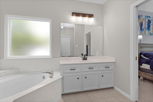 bathroom featuring connected bathroom, tile patterned flooring, vanity, and a garden tub