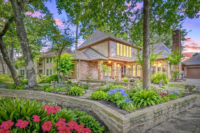 17714 Treeloch Ln, Spring, TX 77379 - view of front of house with brick siding and a chimney