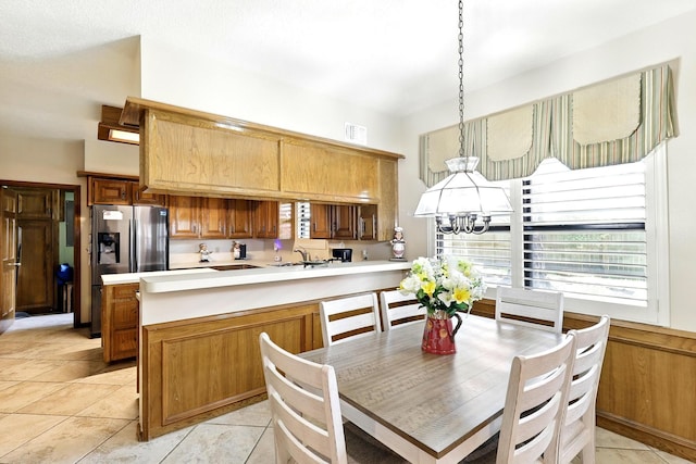 17714 Treeloch Ln, Spring, TX 77379 - dining area with light tile patterned floors and a chandelier