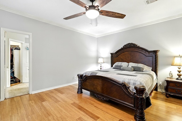 17714 Treeloch Ln, Spring, TX 77379 - bedroom featuring light wood-style flooring, crown molding, baseboards, and ceiling fan
