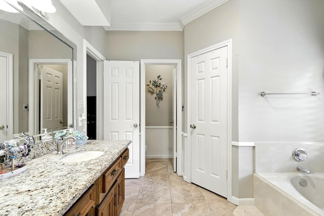 17714 Treeloch Ln, Spring, TX 77379 - bathroom featuring a garden tub, vanity, crown molding, and toilet