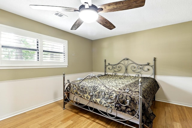 17714 Treeloch Ln, Spring, TX 77379 - bedroom featuring baseboards, wood finished floors, and ceiling fan