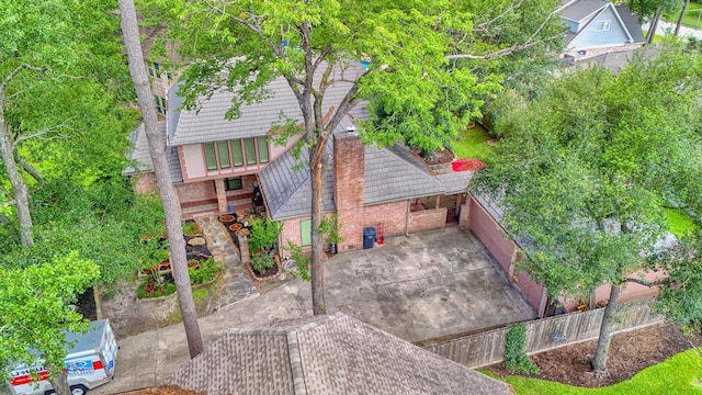 17714 Treeloch Ln, Spring, TX 77379 - view of front facade with brick siding and a tile roof