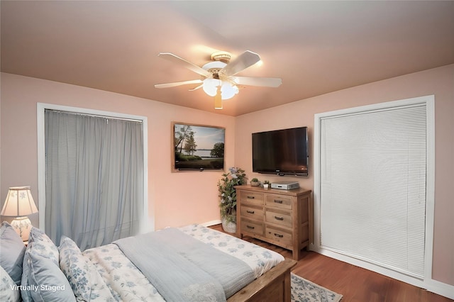3428 S Main St, Anahuac, TX 77514 - bedroom featuring wood finished floors, ceiling fan, and baseboards