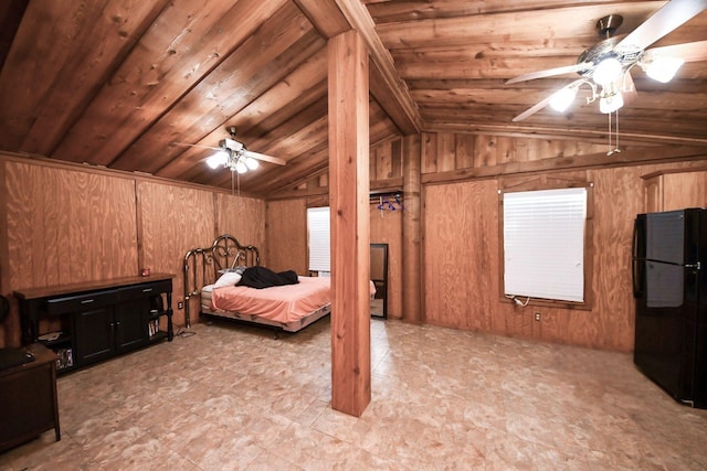 3428 S Main St, Anahuac, TX 77514 - bedroom with freestanding refrigerator, vaulted ceiling, wood walls, and wooden ceiling