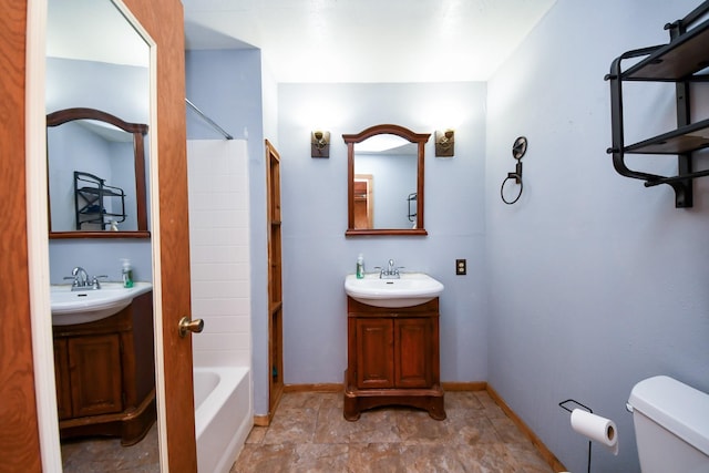 3428 S Main St, Anahuac, TX 77514 - bathroom with toilet, shower / bathtub combination, vanity, and baseboards