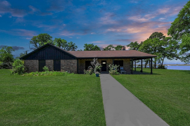 3428 S Main St, Anahuac, TX 77514 - single story home with a yard, brick siding, and a chimney