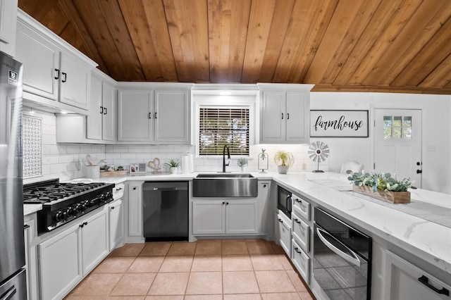 3428 S Main St, Anahuac, TX 77514 - kitchen with dishwasher, a sink, wood ceiling, black gas cooktop, and healthy amount of natural light