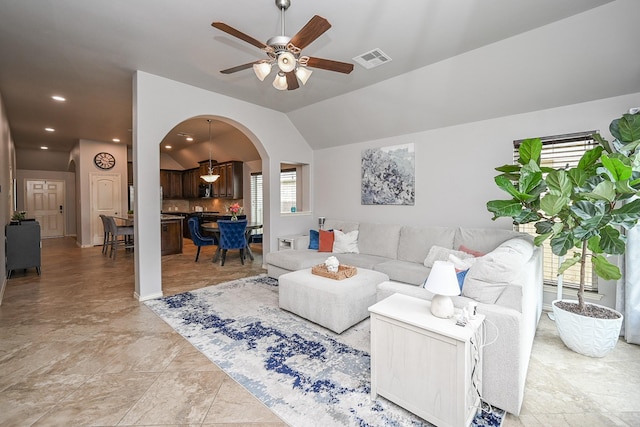 10911 Overland Trail Dr, Richmond, TX 77406 - living area featuring arched walkways, ceiling fan, lofted ceiling, and recessed lighting