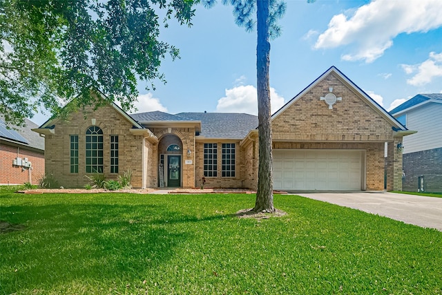 13903 Autumn Grove Ct, Rosharon, TX 77583 - view of front facade with brick siding, concrete driveway, an attached garage, and a front lawn