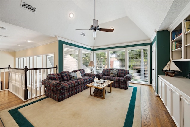 311 Pineview Cir, El Lago, TX 77586 - living area featuring wood finished floors, a ceiling fan, lofted ceiling, ornamental molding, and recessed lighting