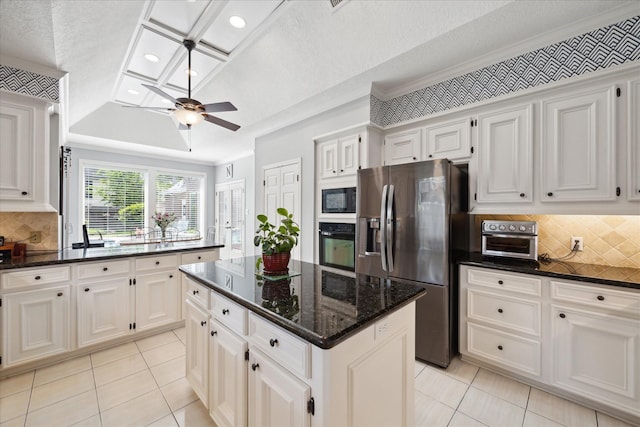 311 Pineview Cir, El Lago, TX 77586 - kitchen with black appliances, light tile patterned floors, a center island, a ceiling fan, and recessed lighting