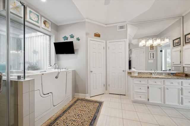 311 Pineview Cir, El Lago, TX 77586 - bathroom featuring a bathtub, vanity, tile patterned flooring, crown molding, and baseboards