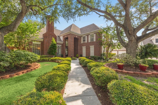 311 Pineview Cir, El Lago, TX 77586 - view of front of home with brick siding and a chimney