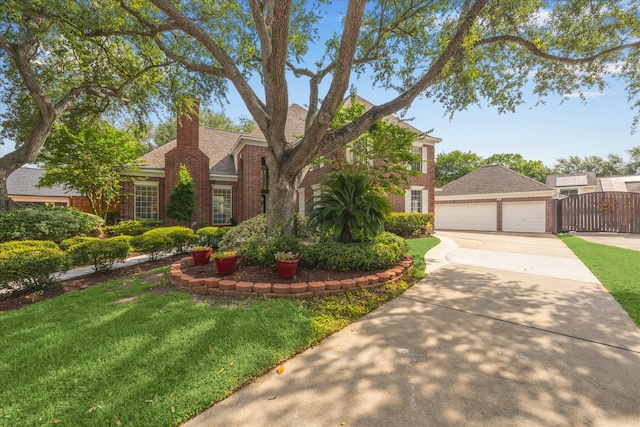 311 Pineview Cir, El Lago, TX 77586 - view of front of house with brick siding, a garage, a gate, and a chimney