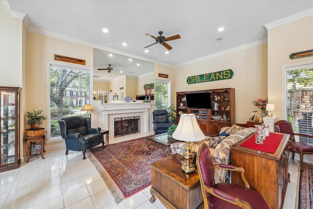 311 Pineview Cir, El Lago, TX 77586 - tiled living area featuring ceiling fan, ornamental molding, a high end fireplace, and recessed lighting