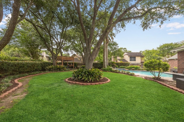 311 Pineview Cir, El Lago, TX 77586 - view of yard featuring an outdoor pool