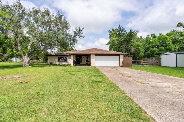 ranch-style house featuring an attached garage and driveway