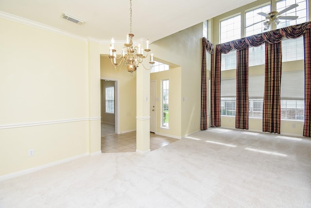 7218 Welshwood Ln, Sugar Land, TX 77479 - unfurnished dining area featuring a chandelier, carpet flooring, baseboards, ornamental molding, and a high ceiling